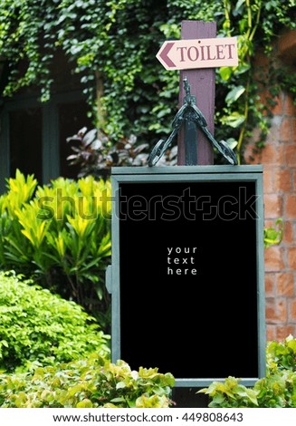 vintage retro style wooden blackboard frame in authentic environment outdoor with space for your text 