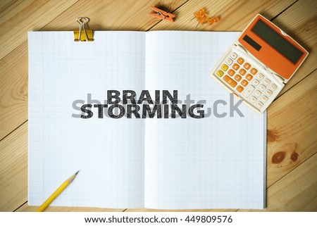 BRAIN STORMING text on paper in the office , business concept