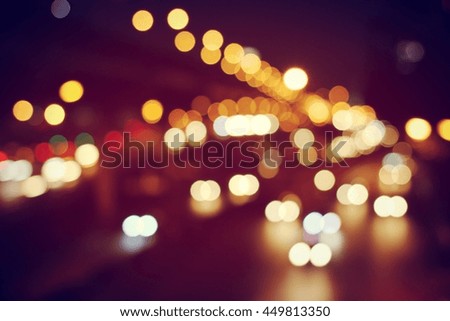 Abstract circular bokeh motion lens blur backround of city and street light at night in Thailand.