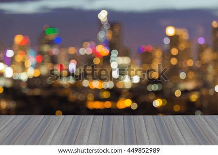 Opening wooden floor, blurred bokeh multiple colours lights office building night view