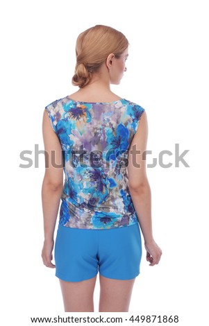 pretty young girl wearing flower printed top and blue shorts