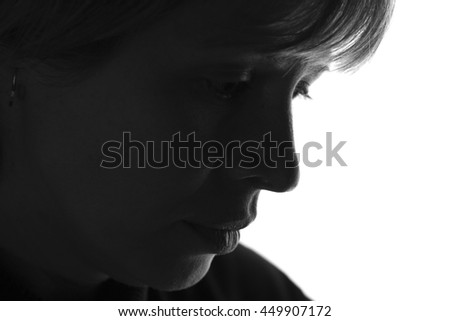 isolated black and white portrait of a woman experiencing negative emotions