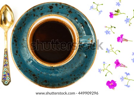 Coffee in a Blue Retro Cup with Flowers. Studio Photo