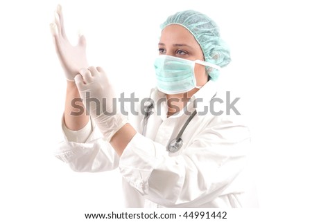 Female medical doctor with stethoscope wearing operation gloves. White background studio picture.