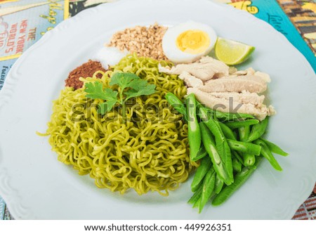 Spicy  noodle vegetable salad on white plate