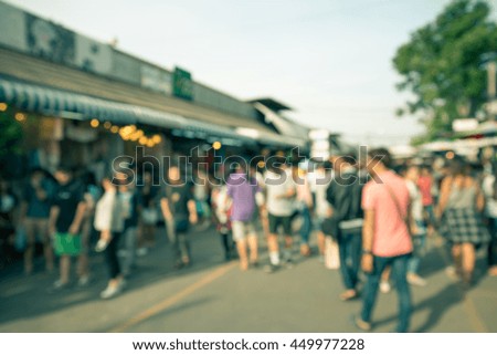 Abstract blur tourist shopping in Chatuchak weekend market outdoor in sunny day Bangkok Thailand background - Retro filter effect