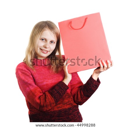 pretty happy cheerful woman holding red shopping bag with empty space for text on it. Image all in red colors isolated on white.