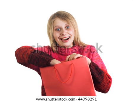 cute funny woman crazy about what she found in her gift bag. Image all in red colors isolated on white background.