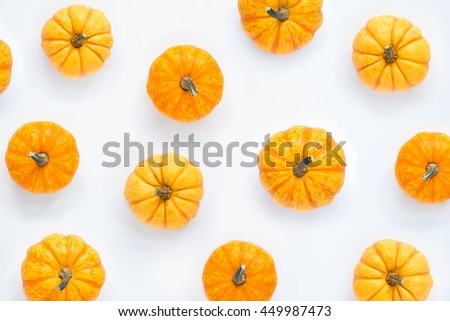 Pumpkins patterned over white background, top view Royalty-Free Stock Photo #449987473