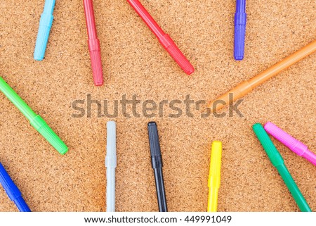 Cork board decorated with twelve watercolor pen