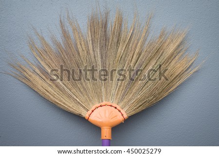brooms on wall backgrounds