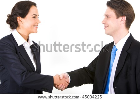 Photo of partners handshaking after signing contract