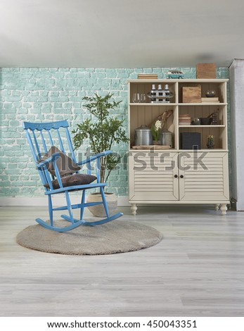 green mint wall with rocking chair sideboard on wood floor-interior

