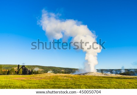 Old faithful on the morning,summer, in Yellowstone National park,Wyoming,usa. Royalty-Free Stock Photo #450050704