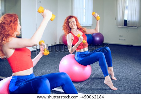 fitness, sport, training and people concept - smiling woman doing exercises on mat in gym