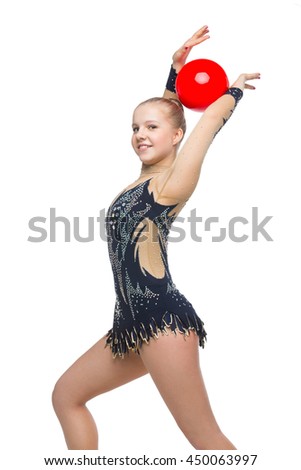 Beautiful gymnast girl with red ball