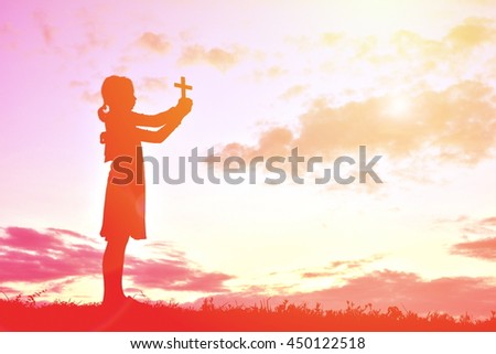 Silhouette people jesus and cross at sunset