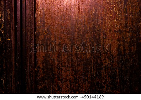 Dark old scary rusty rough golden and copper metal surface texture/background for Halloween or haunted house games background/texture of door or wall