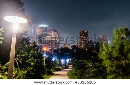A view of skylines Houston with a path leading line of Bay You trail