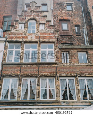 Old vintage brick building facade.

