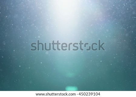 green lens flare with flying in the air particles