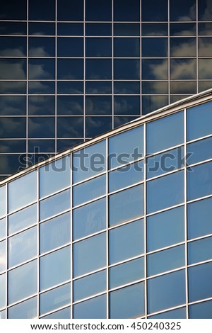 Reflection of the sky in the mirrored windows of a skyscraper, background, texture