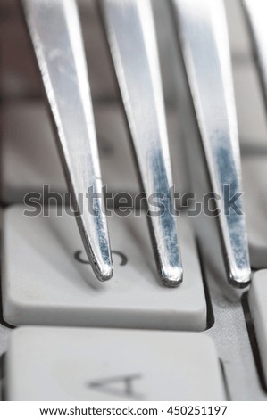 white keyboard and fork