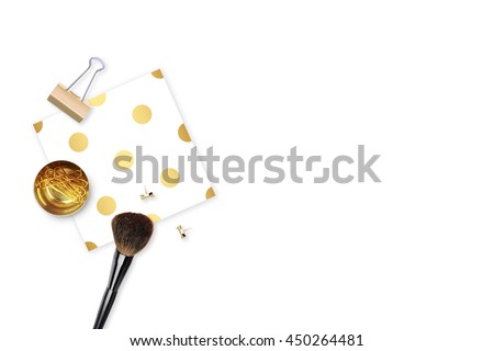 Elegant background. Pattern gold polka dots, and gold clip. Flat lay. Workspace with stationery. Mock-up background. Makeup brush