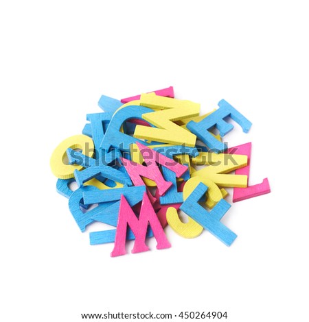 Pile of colorful painted wooden letters isolated over the white background
