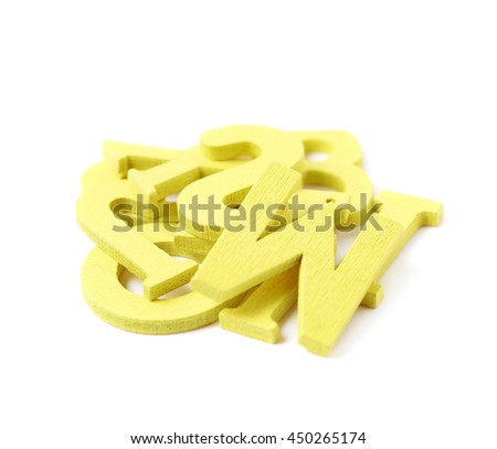 Pile of painted wooden letters isolated over the white background