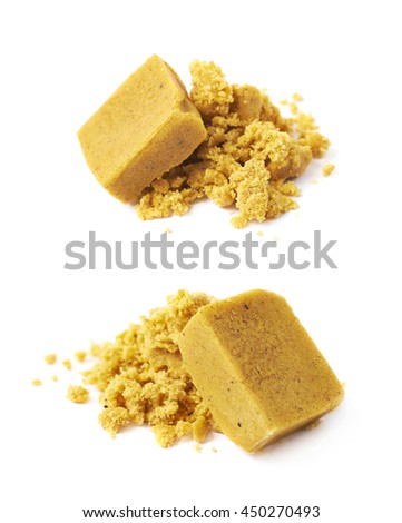 Crushed yellow bouillon stock broth cube isolated over the white background, set of two different foreshortenings