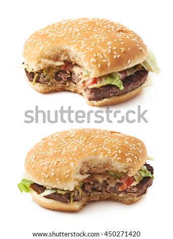 Fresh cooked hamburger with a single bite taken, composition isolated over the white background, set of two different foreshortenings