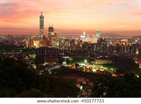 Aerial panorama of downtown Taipei City with Taipei 101 Tower among skyscrapers under dramatic sky ~ A romantic evening in Taipei, the capital city of Taiwan, with beautiful rosy afterglow at sunset