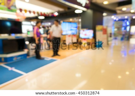 Electronic Department store with bokeh blurred background, Television Retail shop