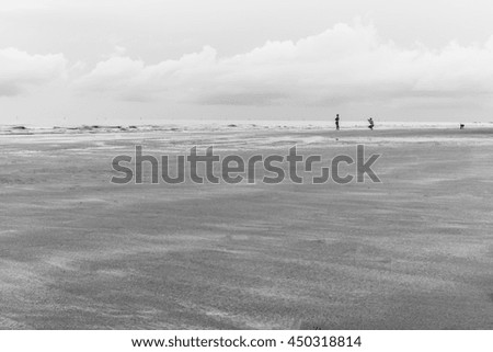 Black and white beach with people background