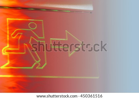 Emergency Fire exit with man escape icon sign in office building.