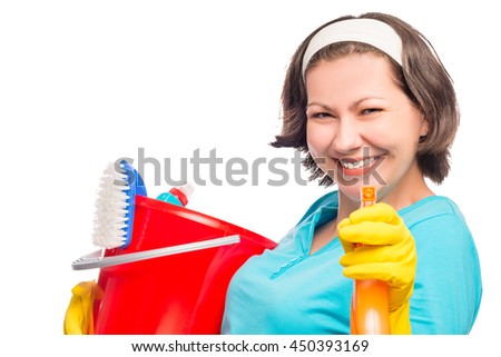 beautiful housewife smiling directs the spray into the camera