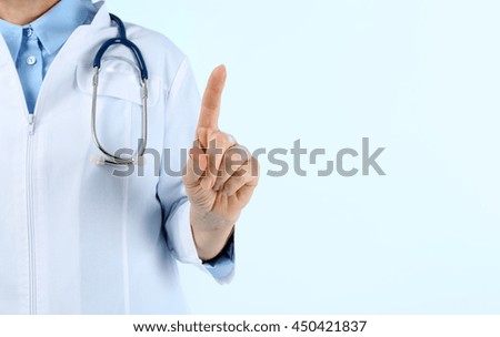 Professional doctor making gesture on blue background