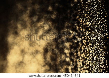 		Dark Gold Glitter wallpaper. Bronze Christmas Glittering background. Holiday abstract texture with golden foil textured effect. 