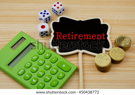 Financial concept- Retirement  (Calculator,coins,dice on wooden background)