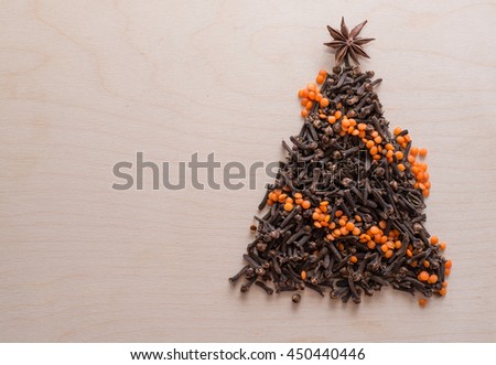 silhouette of a Christmas tree of dried cloves and spices