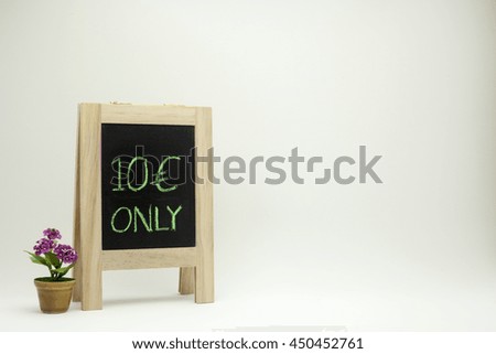The ten euro sign on chalkboard or blackboard standing for business or supermarket or shop marketing discount campaign with minimal plastic flower in brown pot model on white gradient background