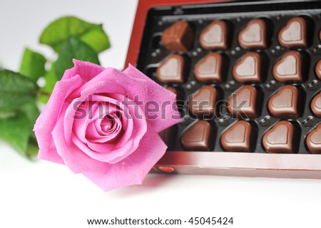  Heart shape chocolate  and pink rose close up