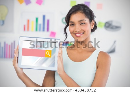 Happy businesswoman showing digital tablet in creative office against logo of a search bar