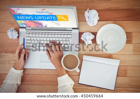 Logo of a search bar in which NEWS UPDATE is written against cropped image of woman with pen using laptop