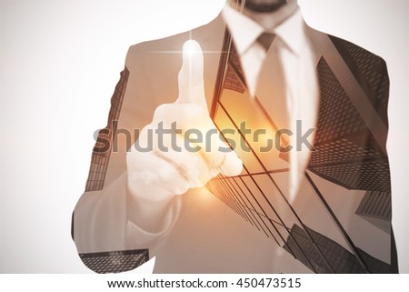 Businessman pointing his finger at camera on white background