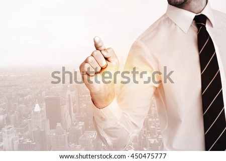Businessman pointing with his finger against new york