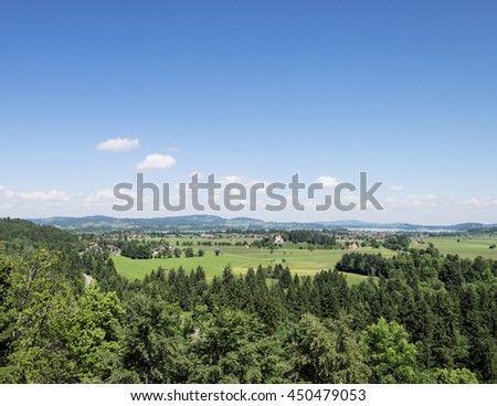 Landscape view from Hohenschwangau Castle in portrait style. Summer blue sky and beautiful nature in Bavaria, Germany