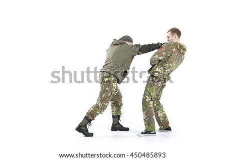 Self-Defending guy from the attacker, isolated on a white background