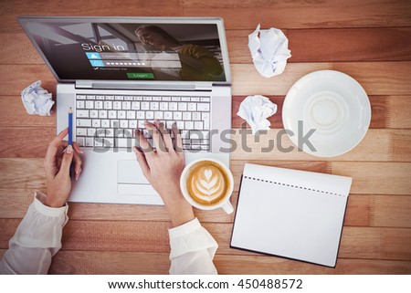 Login screen with blonde woman against cropped image of woman with pen using laptop